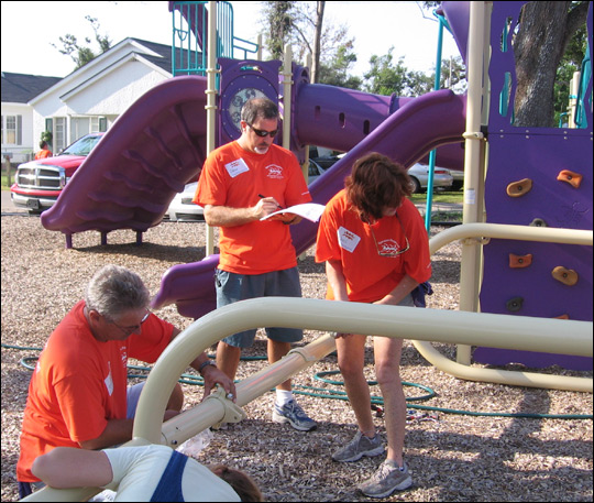 KaBOOM! volunteers assemble a jungle gym in Bay St. Louis, Miss.