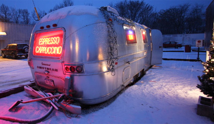 A coffee shop inside of a trailer.