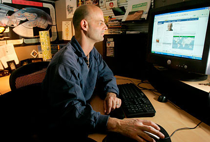 Curtis Soldano looks at his Facebook page.