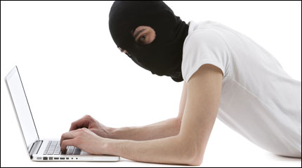 Masked computer hacker