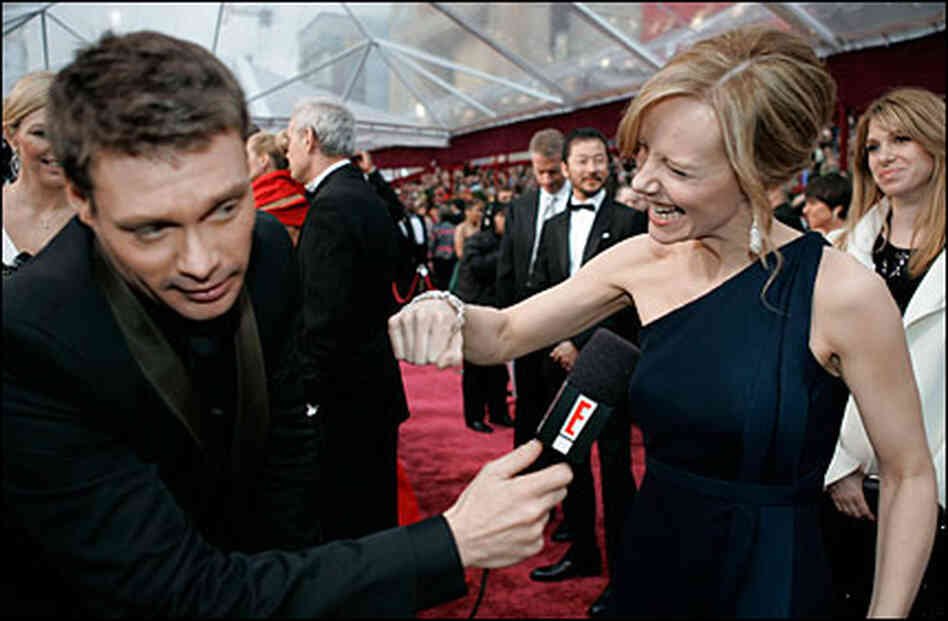 Ryan Seacrest shoves a microphone at Amy Ryan Ryan Seacrest shoves a microphone at Amy Ryan