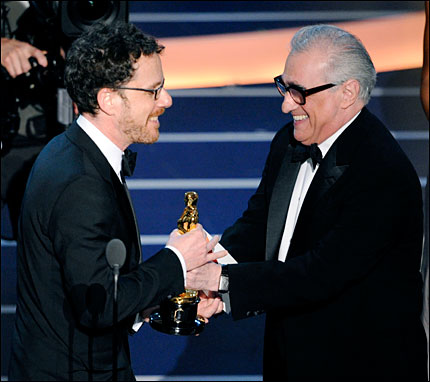 Ethan Coen accepts the Best Director Oscar from Martin Scorsese