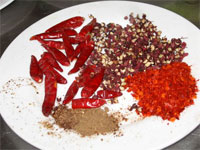 Sichuan peppercorns, crushed chilis and dried chili.