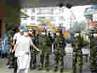 Hospital workers outside the traditional Chinese Medicine Hospital in Dujiangyan, China, in 2008. Ph