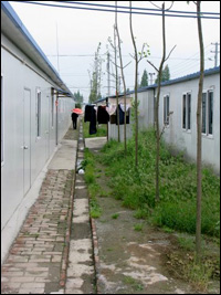 Two rows of shelter at the Tumen transitional housing camp. Photo: Melissa Block, NPR.