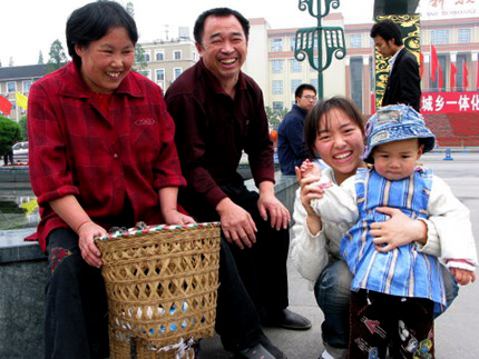 A smiling family in Chengdu, China. Photo: Melissa Block, NPR.