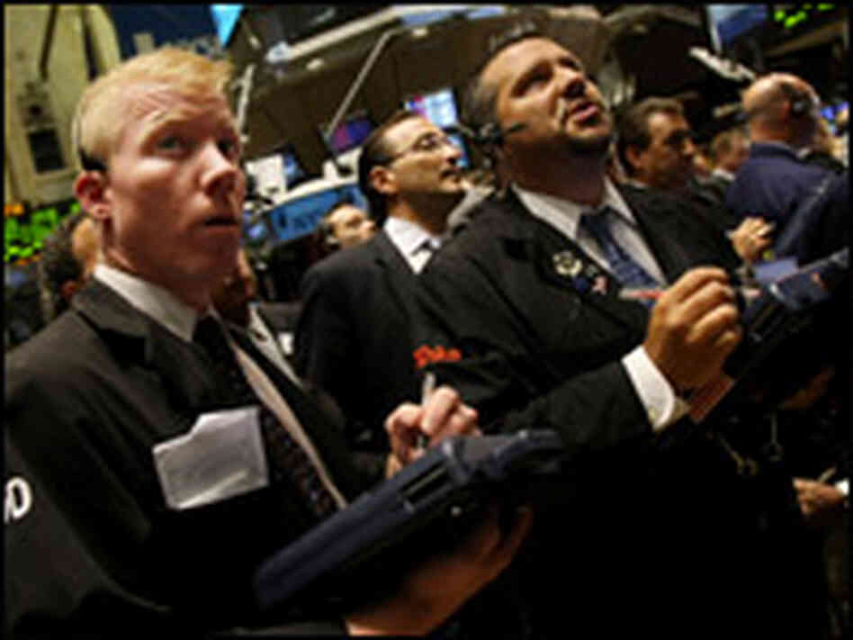 Wall Street traders watch as the stock market falls. Wall Street traders watch as the stock market falls.