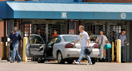 Workers leave GM plant.