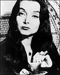Carolyn Jones as Morticia Addams.
