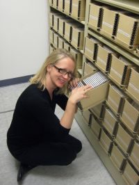 Kerry digs throught the CDs to find just the right story