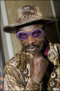 Rudy Ray Moore in purple glitter glasses