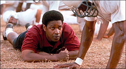 Denzel Washington lying on ground, coaching football