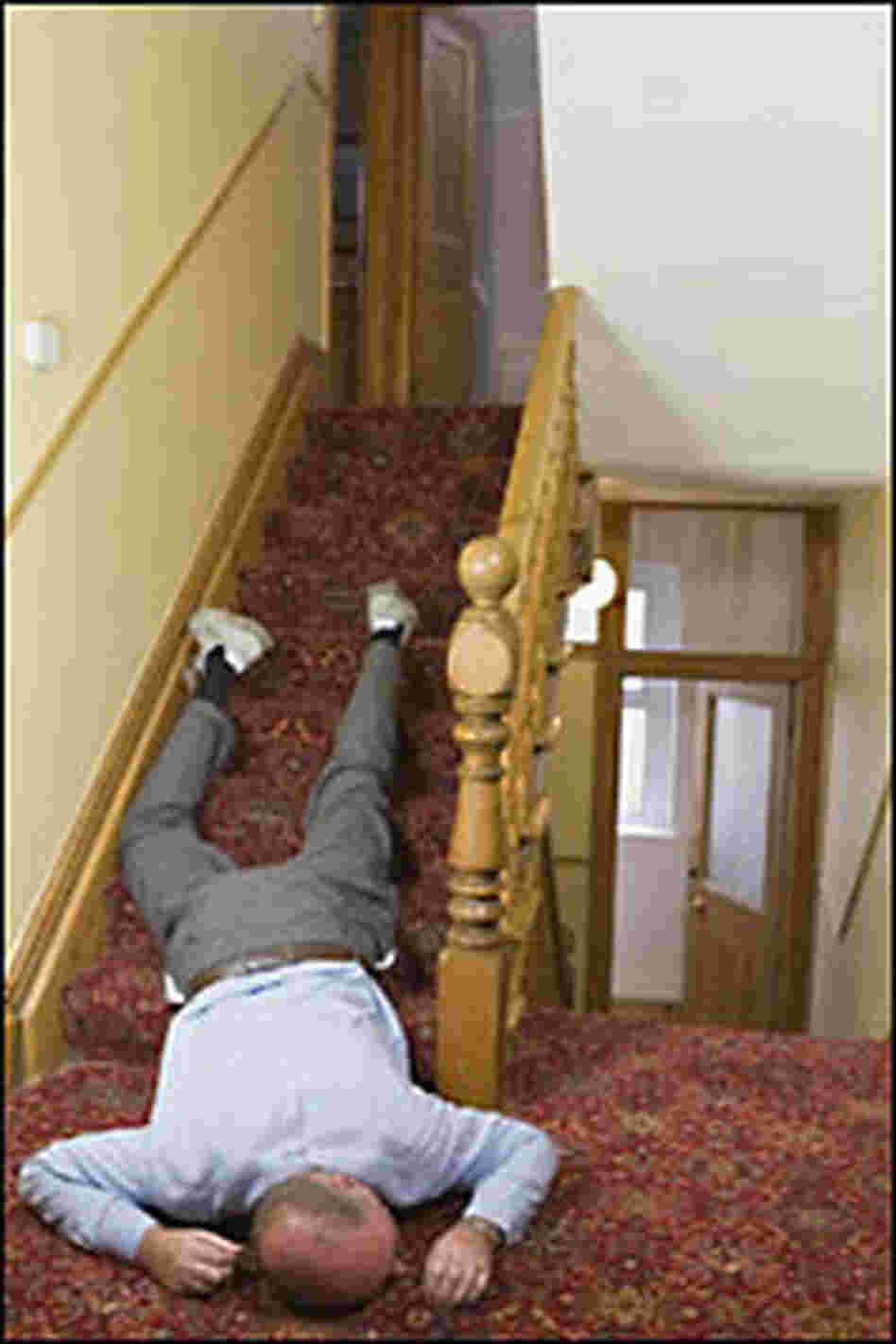 man lying on stairs, passed out from too much turkey man lying on stairs, passed out from too much turkey