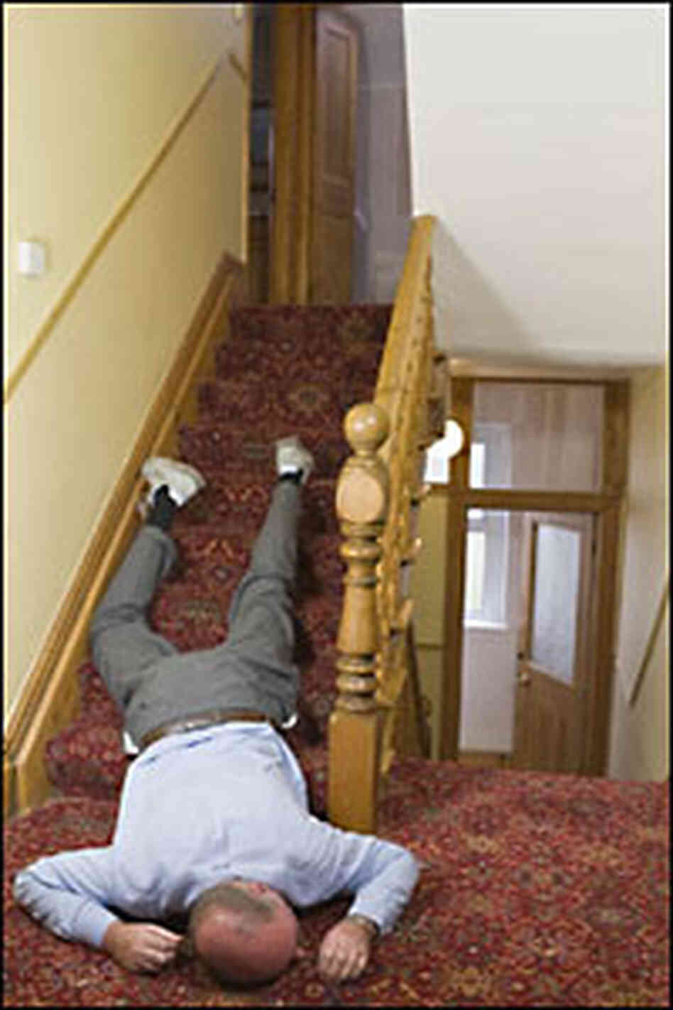 man lying on stairs, passed out from too much turkey man lying on stairs, passed out from too much turkey
