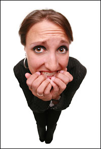 woman looking alarmed. Image: iStockphoto.