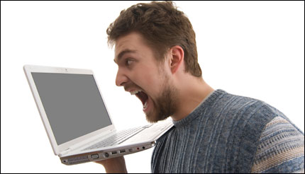man yelling at his computer