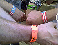 hands with colored wristbands