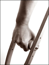 man's hand on a crutch