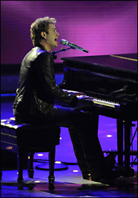 Scott MacIntyre sits at the piano