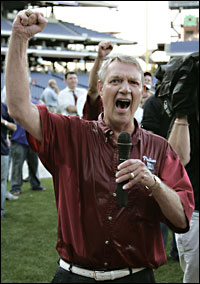Harry Kalas, fist raised over his head