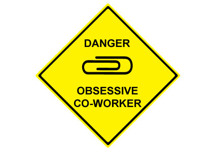 sign reading Danger Obsessed Co-Worker