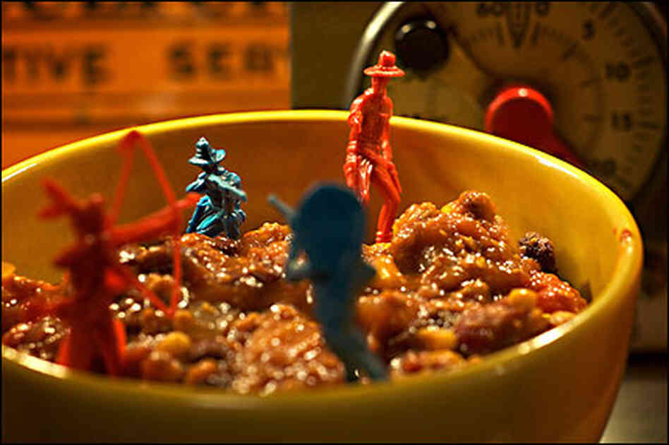 Toy Army men sinking into a bowl of chili Toy Army men sinking into a bowl of chili