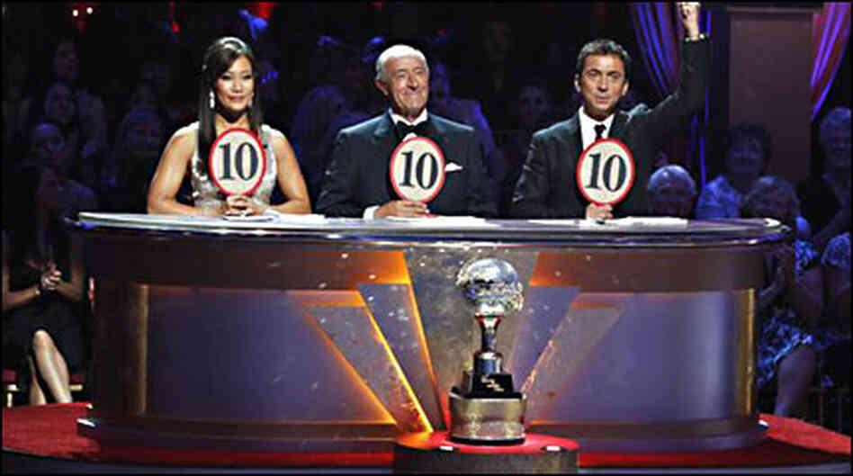 The judges of Dancing With The Stars hold up their scoring paddles The judges of Dancing With The Stars hold up their scoring paddles