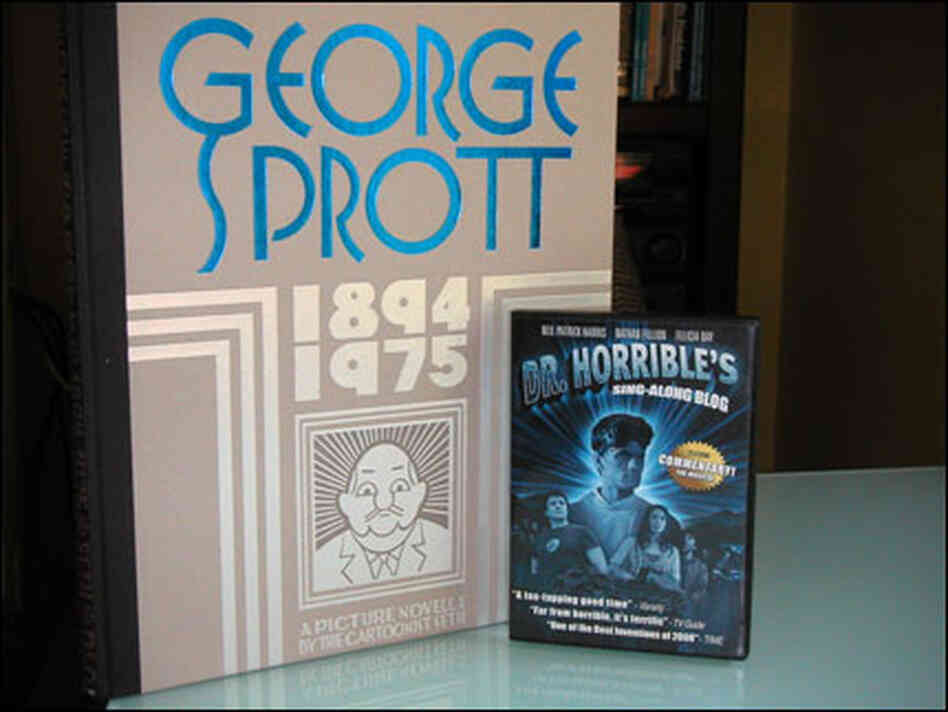 DVD case next to great big book DVD case next to great big book
