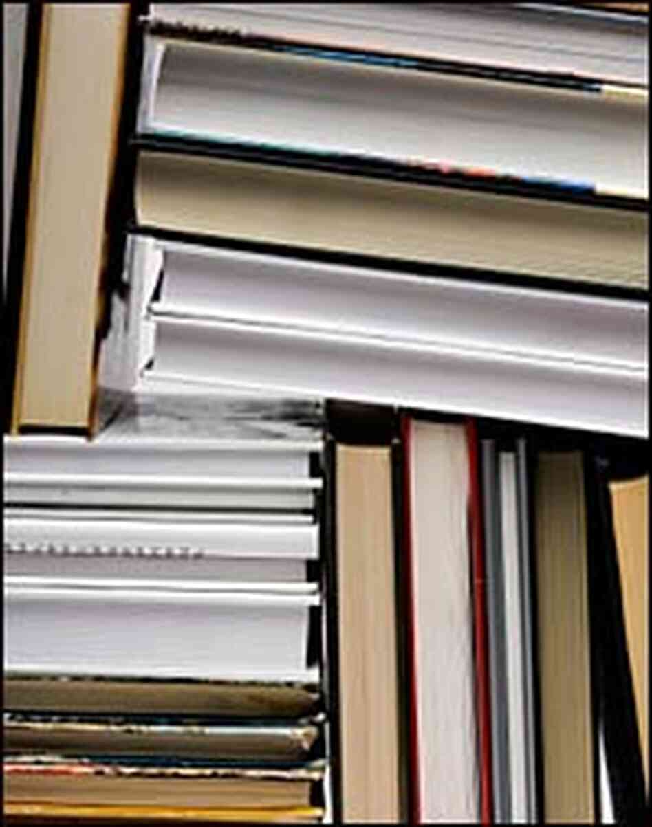 a crowded shelf of books a crowded shelf of books