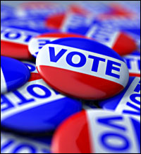 a pile of buttons that say 'VOTE'