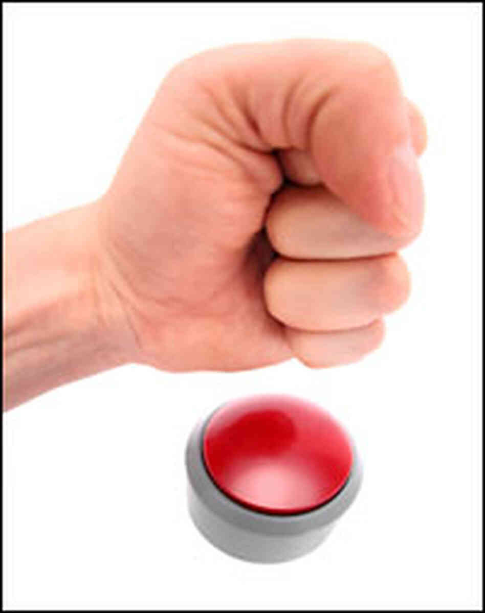 a hand coming down to hit a buzzer a hand coming down to hit a buzzer