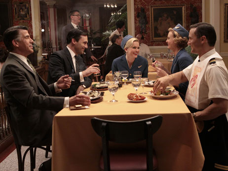 Don Draper (Jon Hamm) and Salvatore Romano (Bryan Batt) have dinner with friends on the season premiere of AMC's Mad Men.
