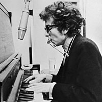 Bob Dylan at the piano, circa 1965.
