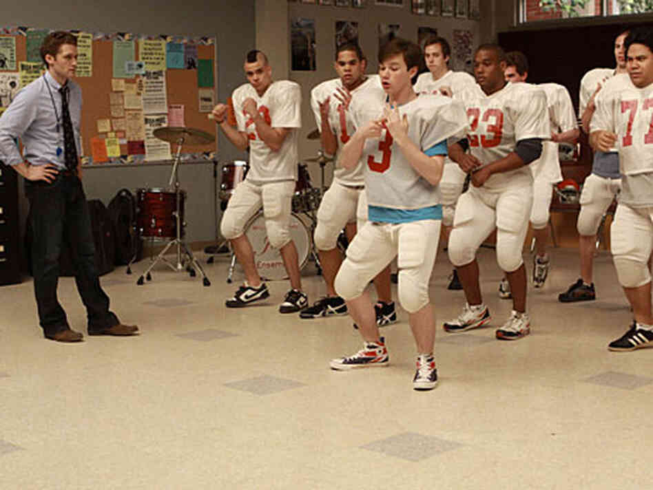 The hit show 'Glee' is about high school kids singing Top 40 songs in their glee club. The hit show 'Glee' is about high school kids singing Top 40 songs in their glee club.