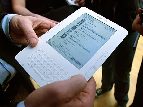 Hands holding the Amazon Kindle 2.