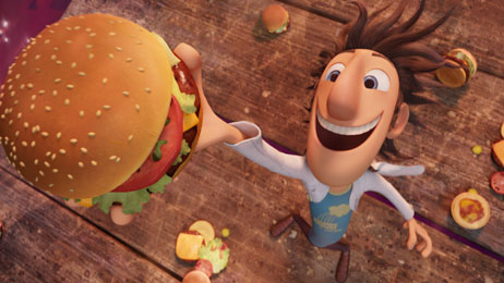 Flint Lockwood (voice of Bill Hader) grabs for a falling cheeseburger in <em>Cloudy With A Chance Of Meatballs</em>.