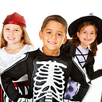 Three kids dressed as a pirate, a skeleton, and a witch.