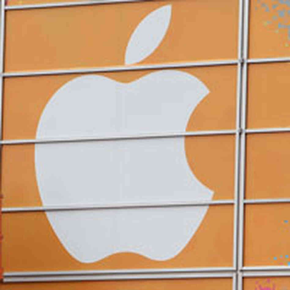 The apple logo, on the side of a building. The apple logo, on the side of a building.