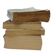 a pile of old paperback books.