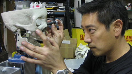 Grant Imahara works on the roboskeleton.
