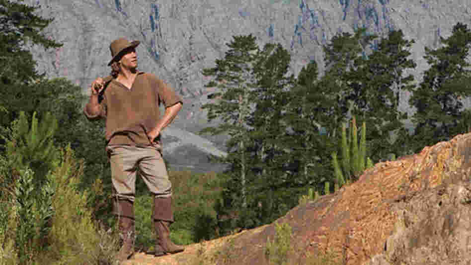 A man ponders the land in America: The Story Of Us. A man ponders the land in America: The Story Of Us.