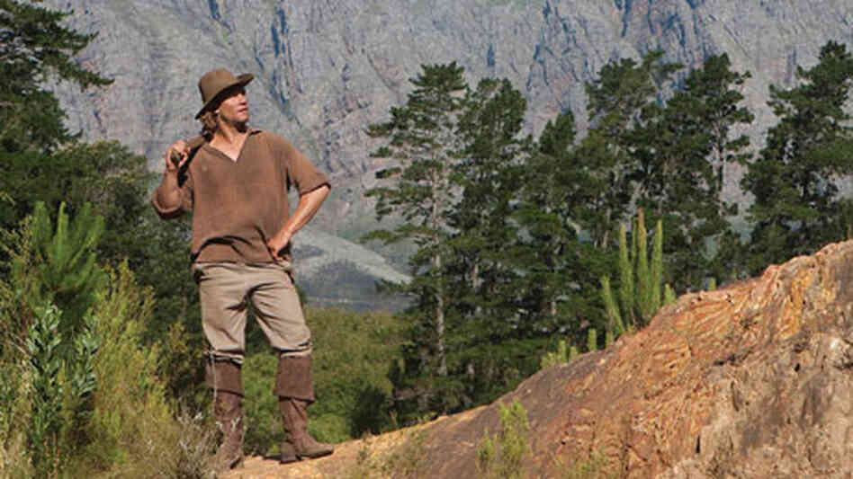 A man ponders the land in America: The Story Of Us. A man ponders the land in America: The Story Of Us.