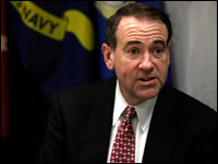 Republican presidential candidate Mike Huckabee speaks during a meeting with retired generals and admirals in Des Moines. Photo by Yana Paskova/Getty Images.