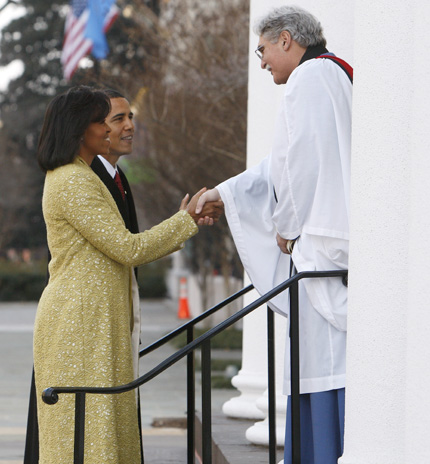 President-elect Barack Obama and Michelle Obama are welcomed by Rev. Luis Leon as the arrive for church service at St. John's Episcopal Church across from the White House in Washington, Tuesday, Jan. 20, 2009. AP Photo/Charles Dharapak.