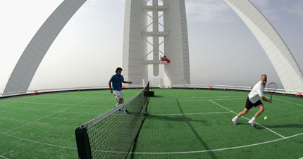 Roger Federer and Andre Agassi playing tennis.