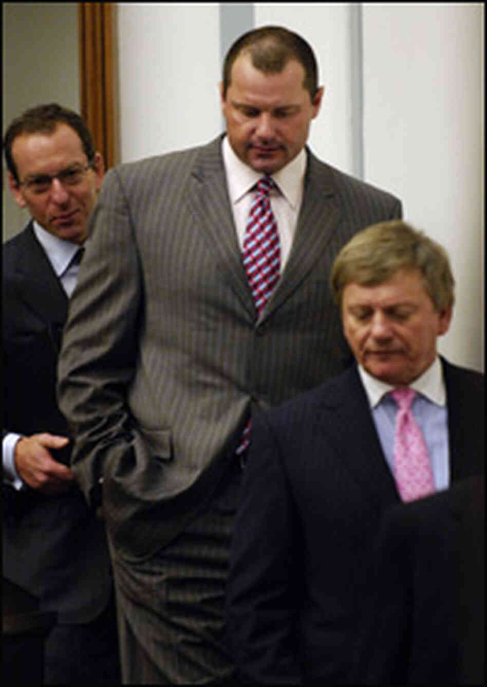 Roger Clemens, flanked by lawyers. Roger Clemens, flanked by lawyers.