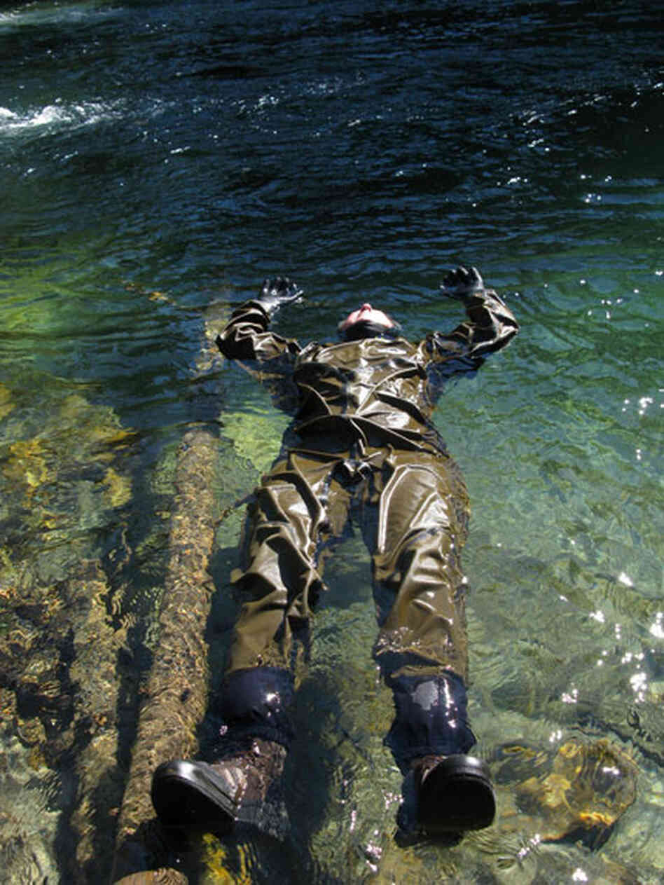 human in dry suit floating human in dry suit floating