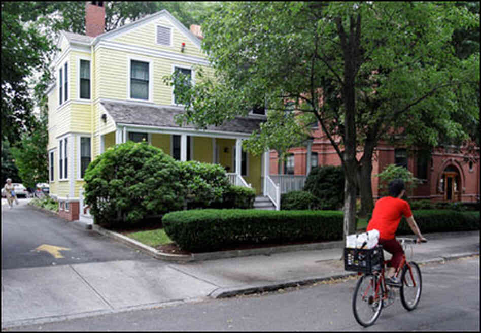 A bicyclist passes by the home of Harvard Scholar Henry Louis Gates in Cambridge, Mass. Gates was A bicyclist passes by the home of Harvard Scholar Henry Louis Gates in Cambridge, Mass. Gates was