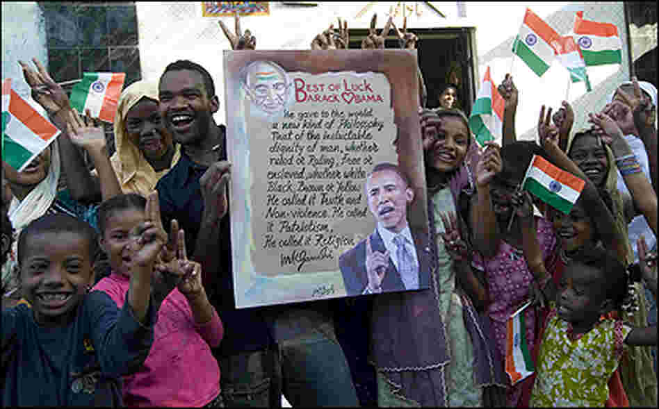 Indian Siddi Tribals hold posters, along with Indian National Flags, in support of Barack Obama's Indian Siddi Tribals hold posters, along with Indian National Flags, in support of Barack Obama's