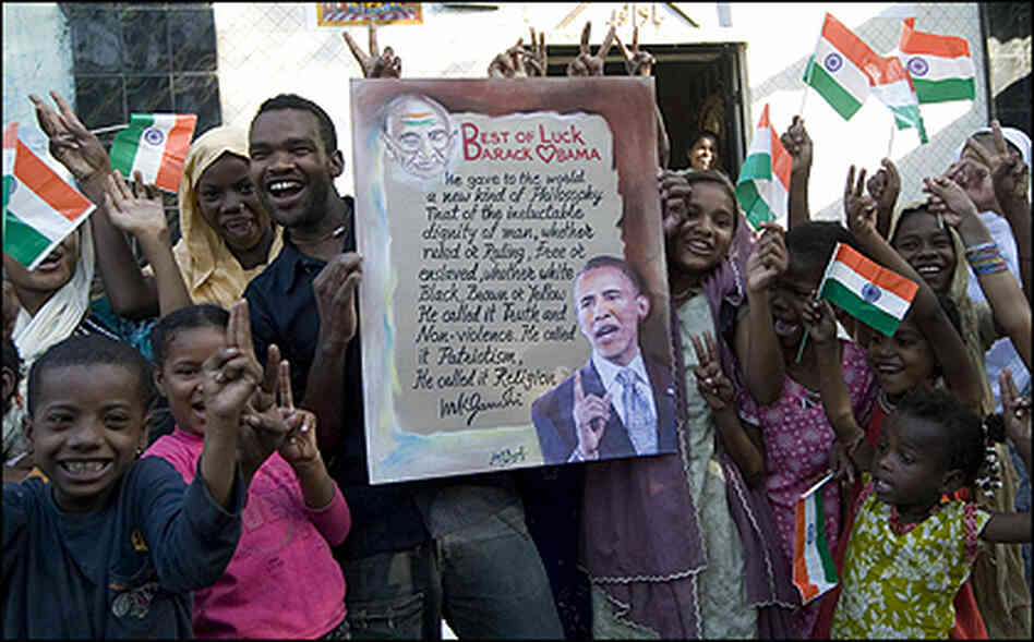 Indian Siddi Tribals hold posters, along with Indian National Flags, in support of Barack Obama's Indian Siddi Tribals hold posters, along with Indian National Flags, in support of Barack Obama's